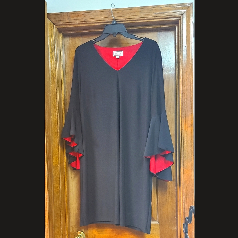 Black dress with flare sleeves and red underneath